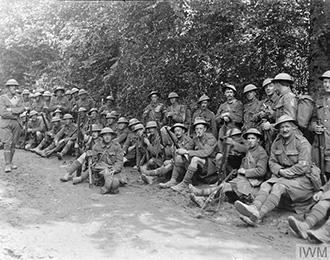 Men of 6th BW resting on the road back to St. Imoges